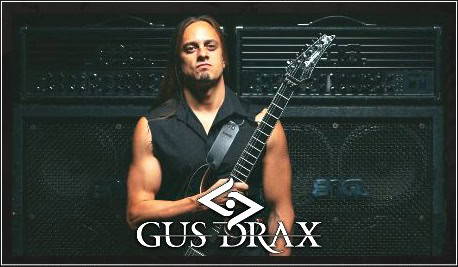 Gus Drax guitar player with amplifier stack in the background.