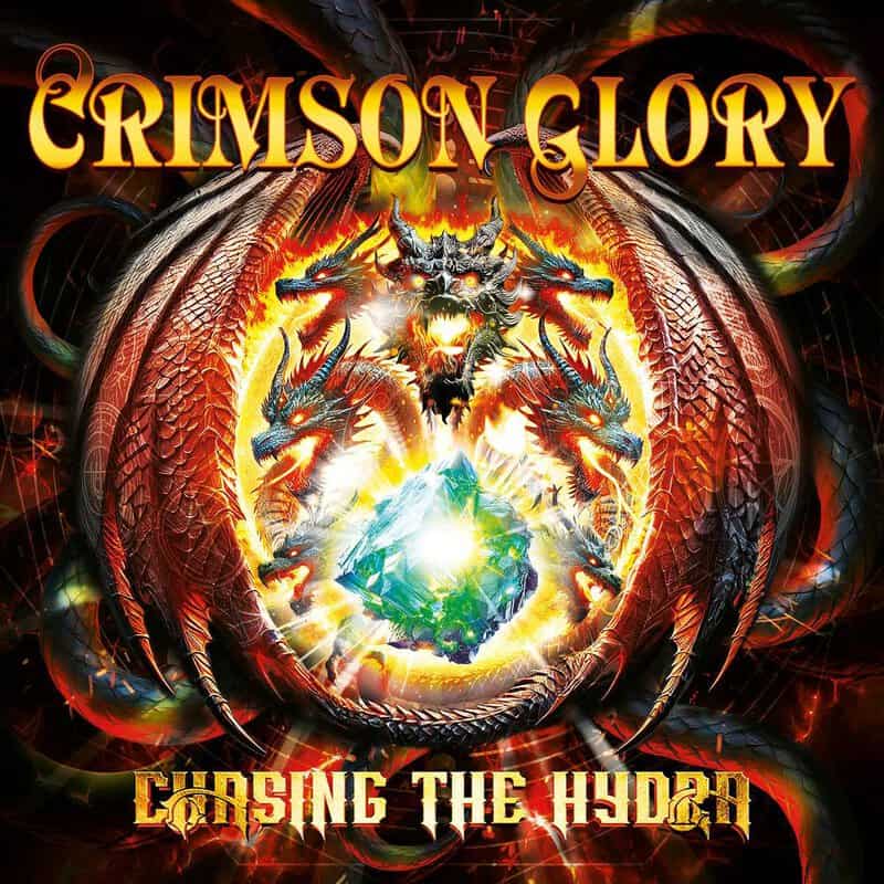 Album cover for Crimson Glory: Chasing the Hydra featuring a fiery, multi-headed dragon surrounding a glowing crystal orb