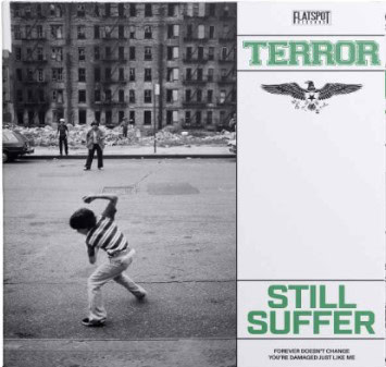 Black-and-white street scene: a boy in a striped shirt throwing a rock in the foreground, ruined buildings in the background; a right-hand panel reads ‘TERROR’ and ‘STILL SUFFER’ with an eagle emblem.
