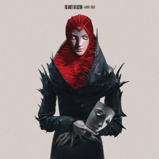 Movie poster featuring a red-hooded figure in a black cloak, holding a pale gray mask against a pale background.