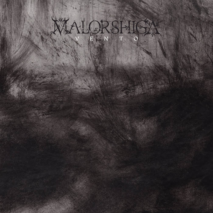 Album cover with a dark, smoky gray background and stylized text at the top showing the artist name and album title.