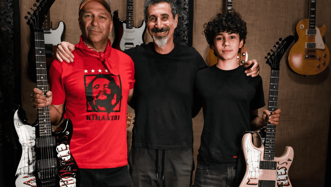 Three men pose with guitars in a music studio.
