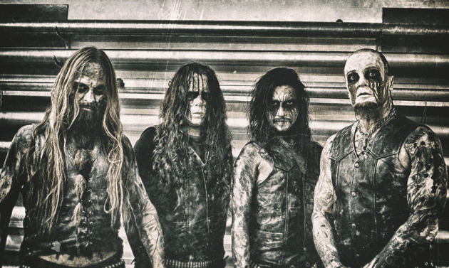 Four men in leather jackets and corpse paint stand side by side against a gritty metal backdrop, a promo-style band photo.