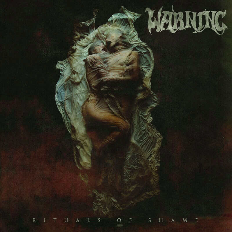 Album cover showing a shrouded, wrapped figure against a dark background; text reads 'RITUALS OF SHAME' at bottom.